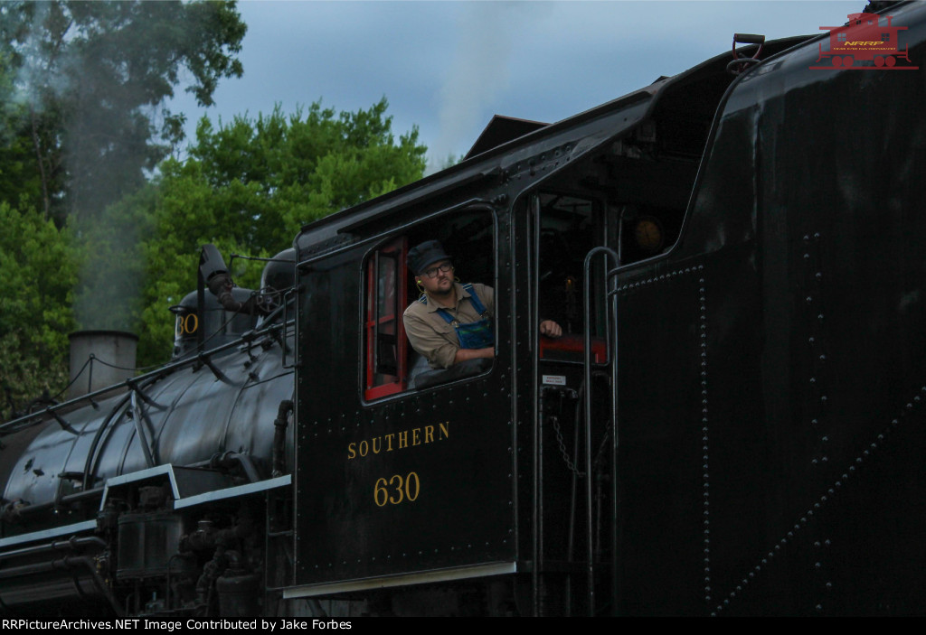 630s fireman leaning out the window.